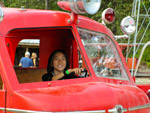 Claire driving the old fire truck at Remlinger Farms.