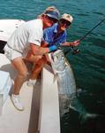 In Key West, FL with an 85 lb. tarpon taken on 12 lb. test. June 1993.